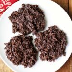 Coconut haystacks are served on a white plate.
