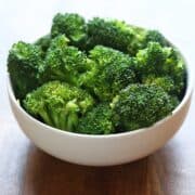 Microwave broccoli is served in a white bowl.