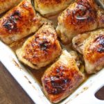 Soy sauce chicken is served in a white baking dish.