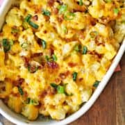 Cauliflower casserole is served in a white baking dish.
