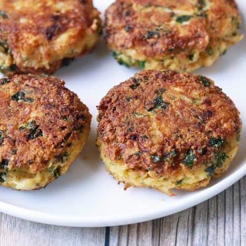 Keto crab cakes are served on a white plate.