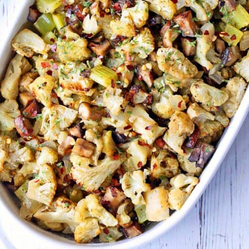Cauliflower stuffing is served in a white baking dish.