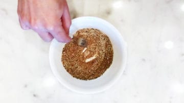 Mixing spices in a bowl.