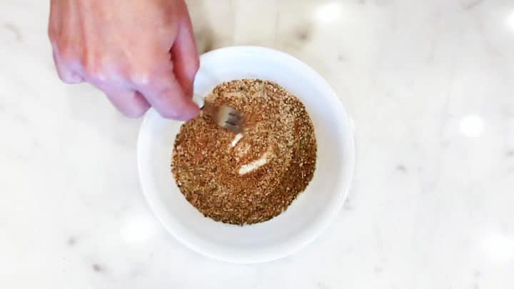 Mixing spices in a bowl.