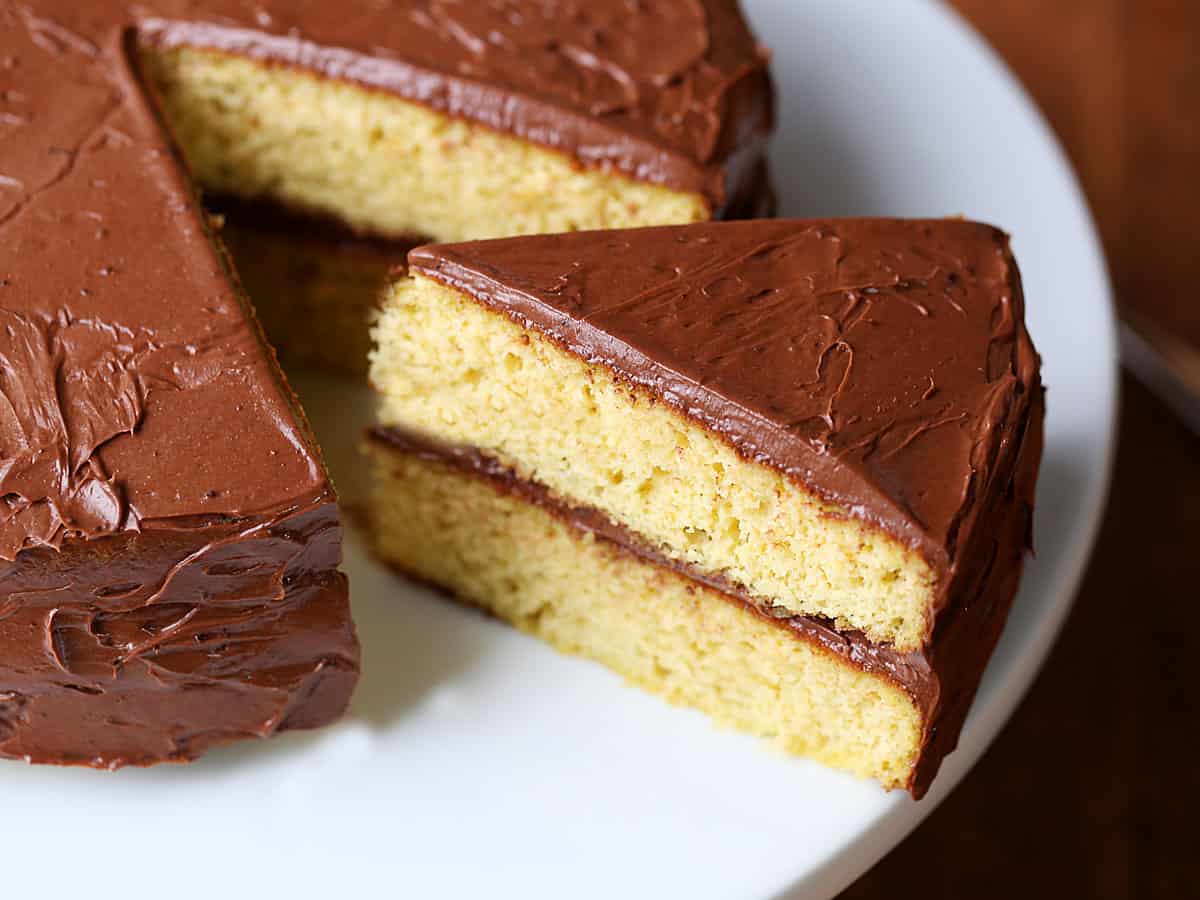 A low-carb birthday cake served on a white plate.