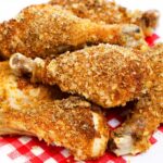 Keto-fried chicken is served on top of a red checkered napkin.