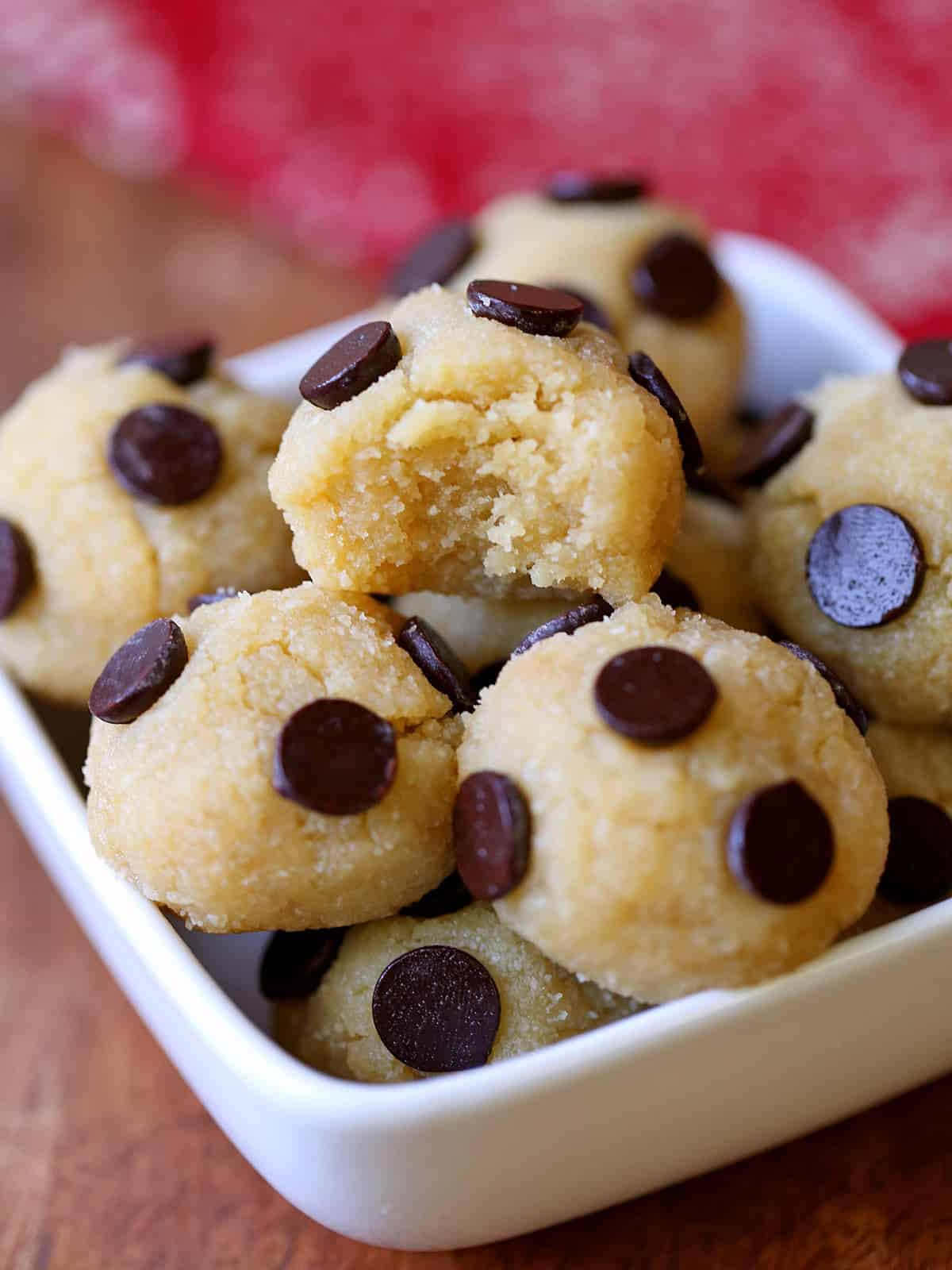 Keto cookie dough is served in a white bowl. 