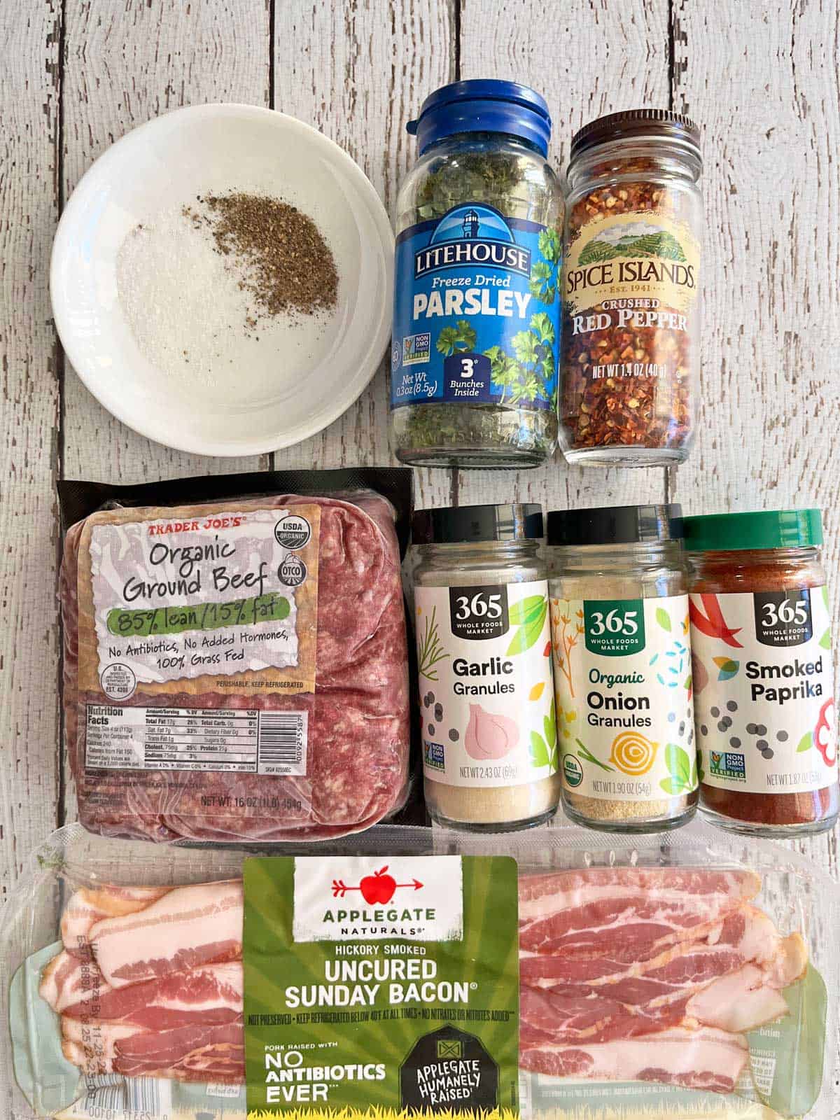The ingredients needed to make a bacon burger.