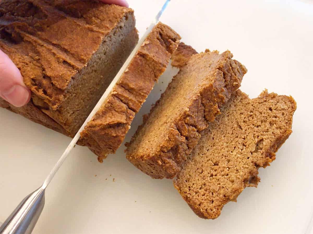 Slicing keto pumpkin bread.