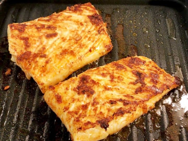 The halibut is ready on the grill.