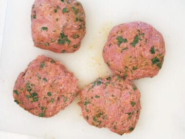 Four turkey burger patties.