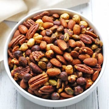 Roasted nuts are served in a bowl.