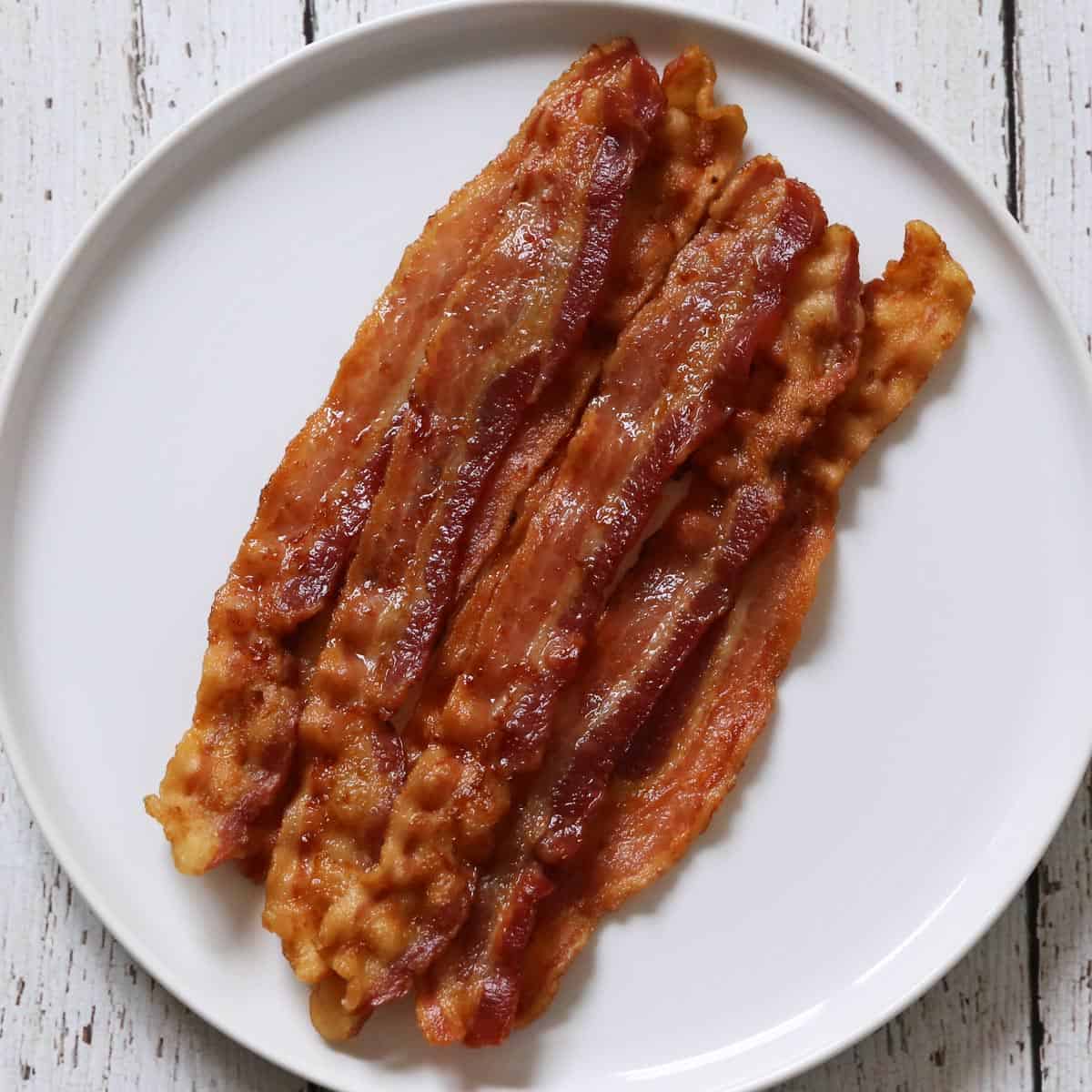 Bacon baked for 25 minutes in a 425°F oven.