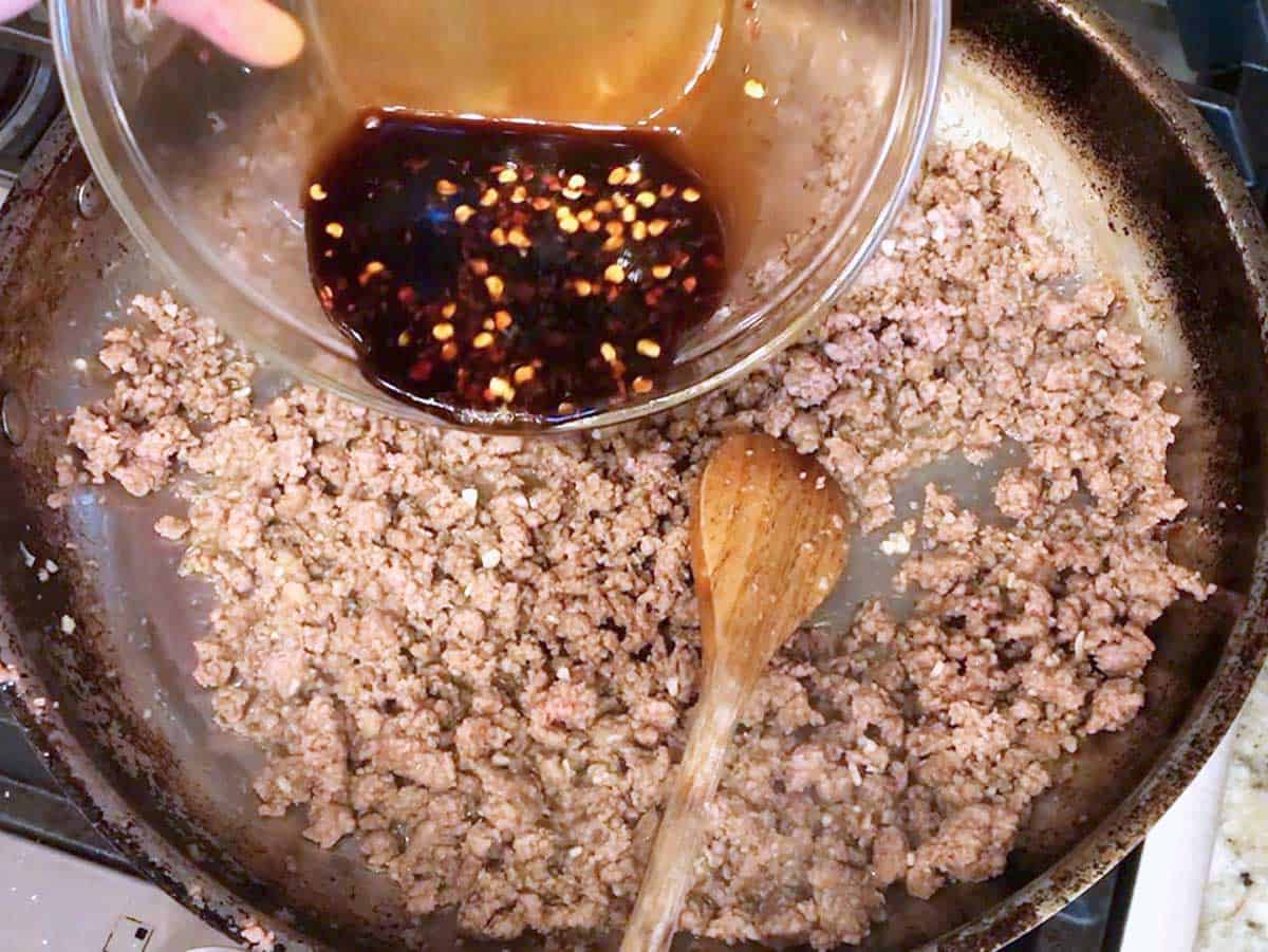 Adding the sauce.