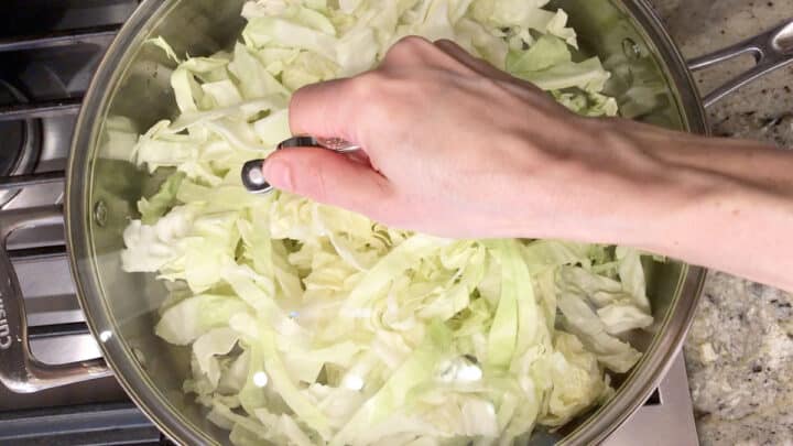 Covering the skillet with a lid.