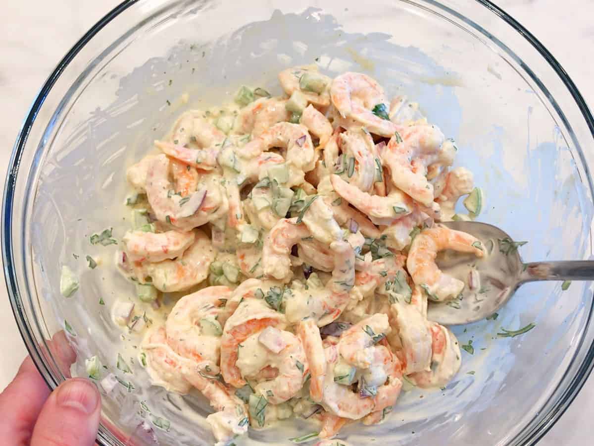 Mixing the salad.