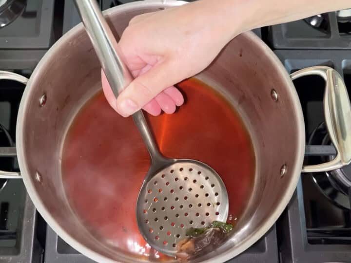Straining the tea.