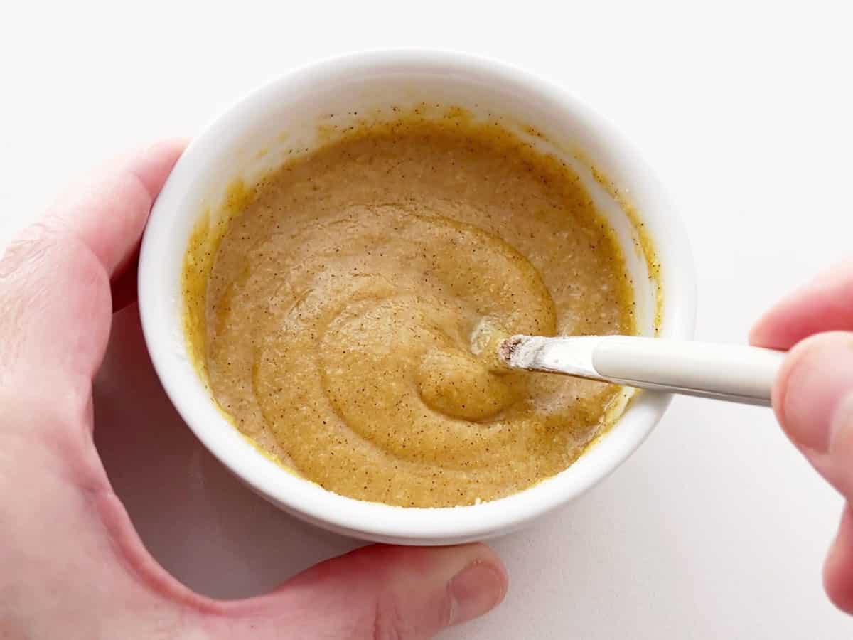 Mixing in cinnamon.