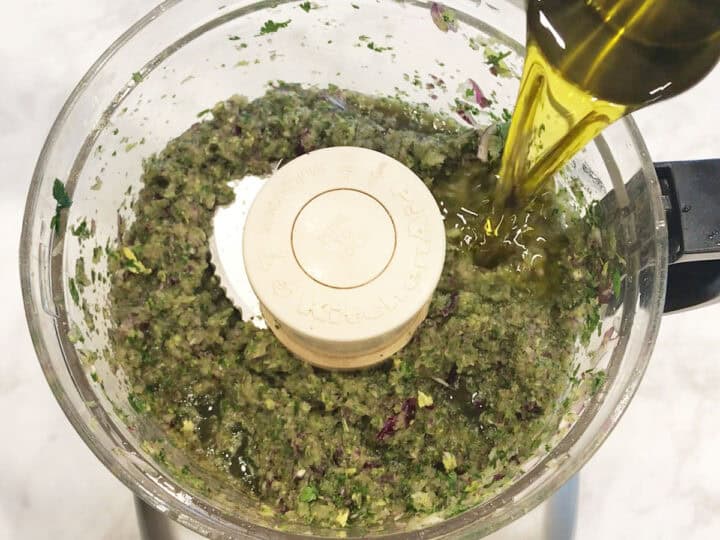 Adding olive oil.