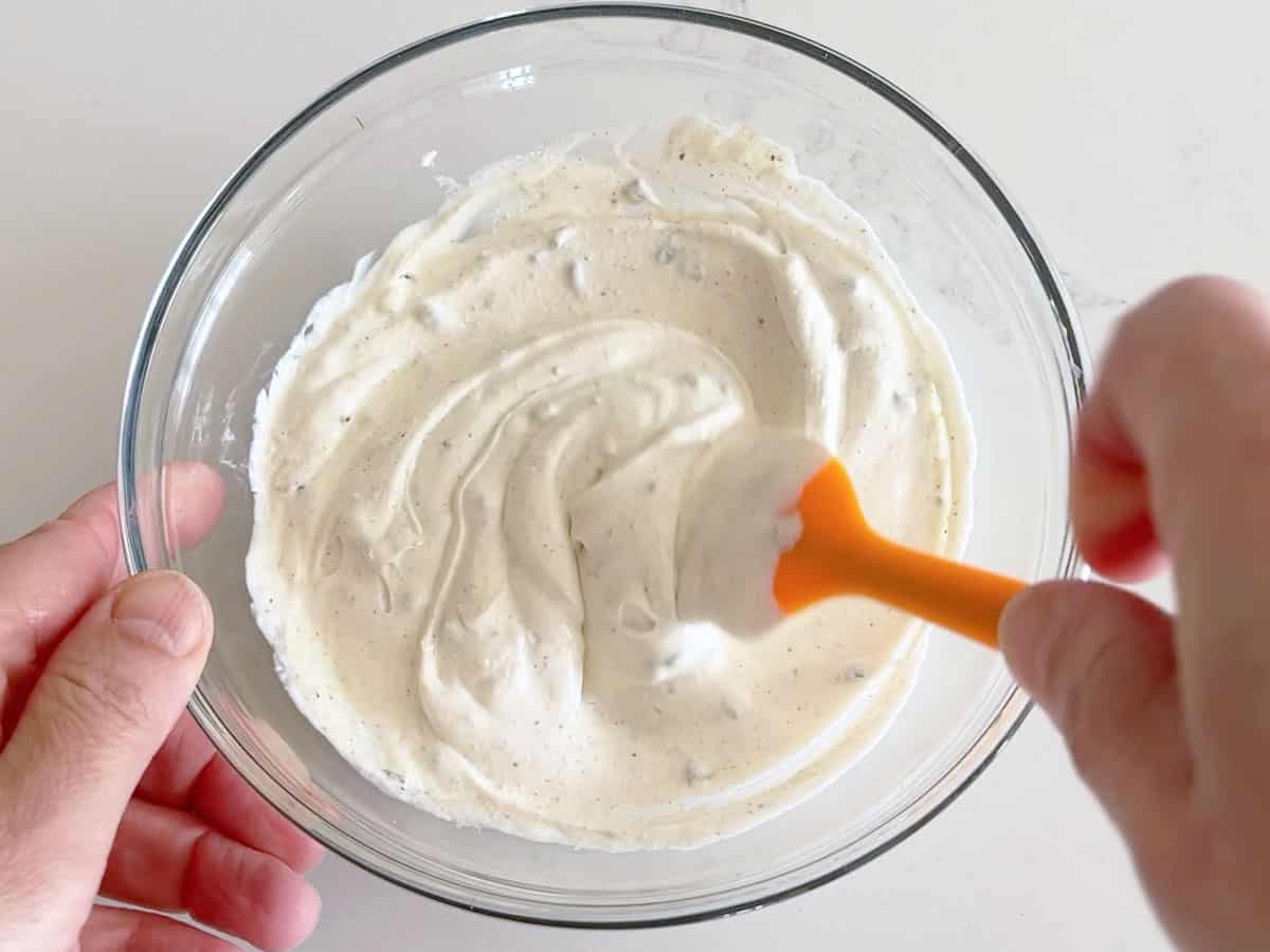 Mixing the dip.