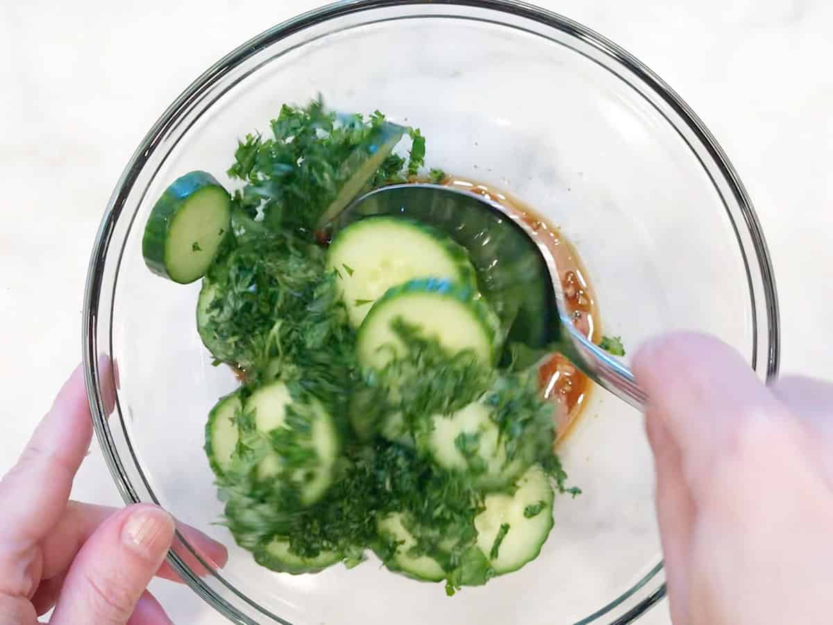 Mixing the salad.