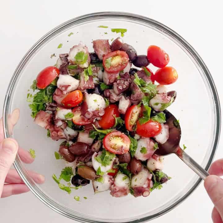 Mixing the salad.