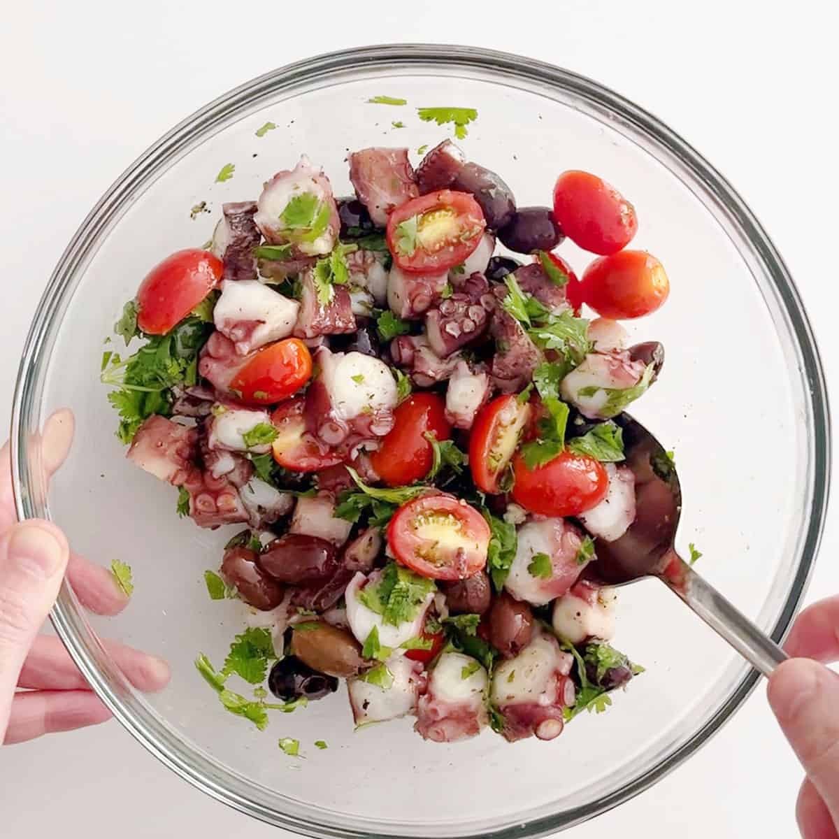 Mixing the salad.