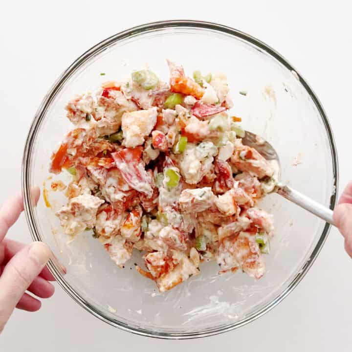 Mixing the salad.