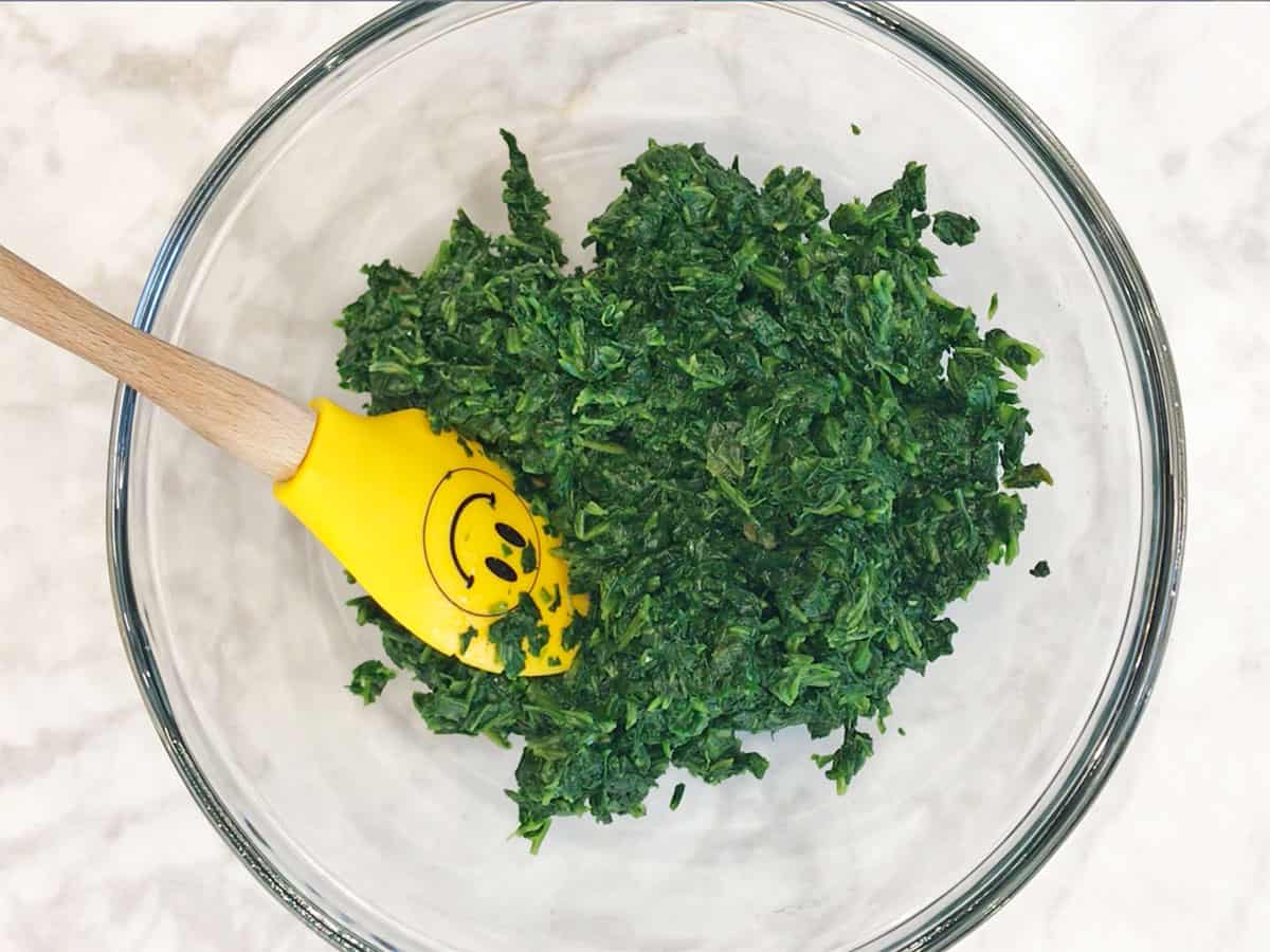 Drained spinach in a bowl.