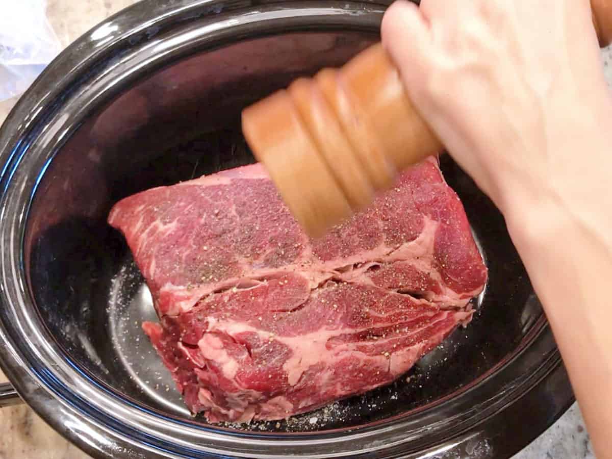 Seasoning the meat.
