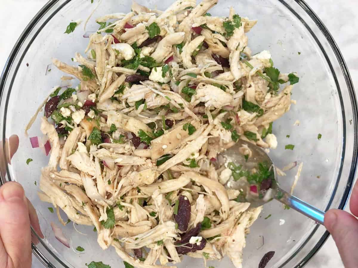 Mixing the salad.