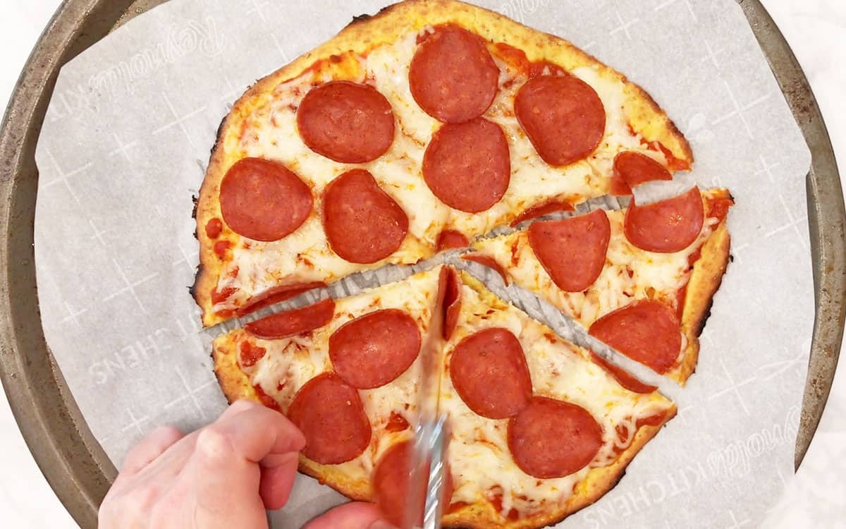 Slicing the pizza.