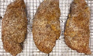 The coated chicken is ready for the oven.