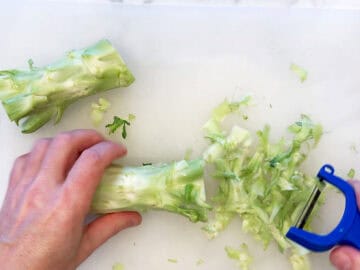 Peeling the stalk.
