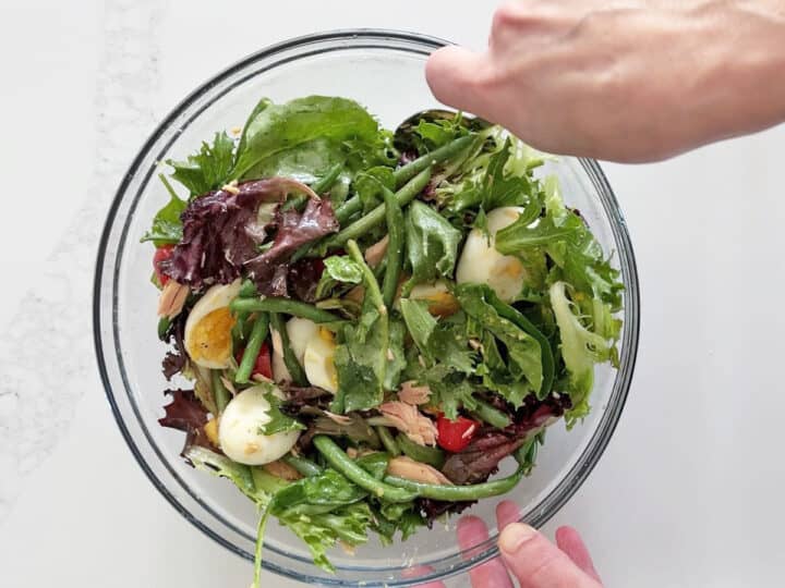 Mixing the salad.