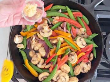 Adding garlic and ginger.