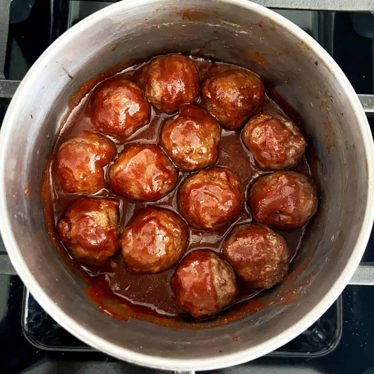 Cocktail meatballs in a saucepan.