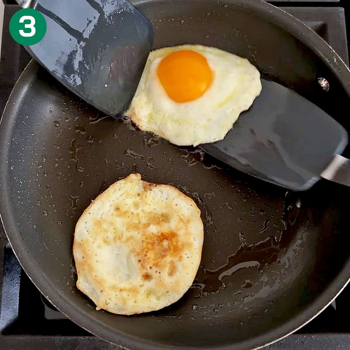 Flipping the eggs.