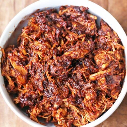 Pulled chicken is served in a bowl.