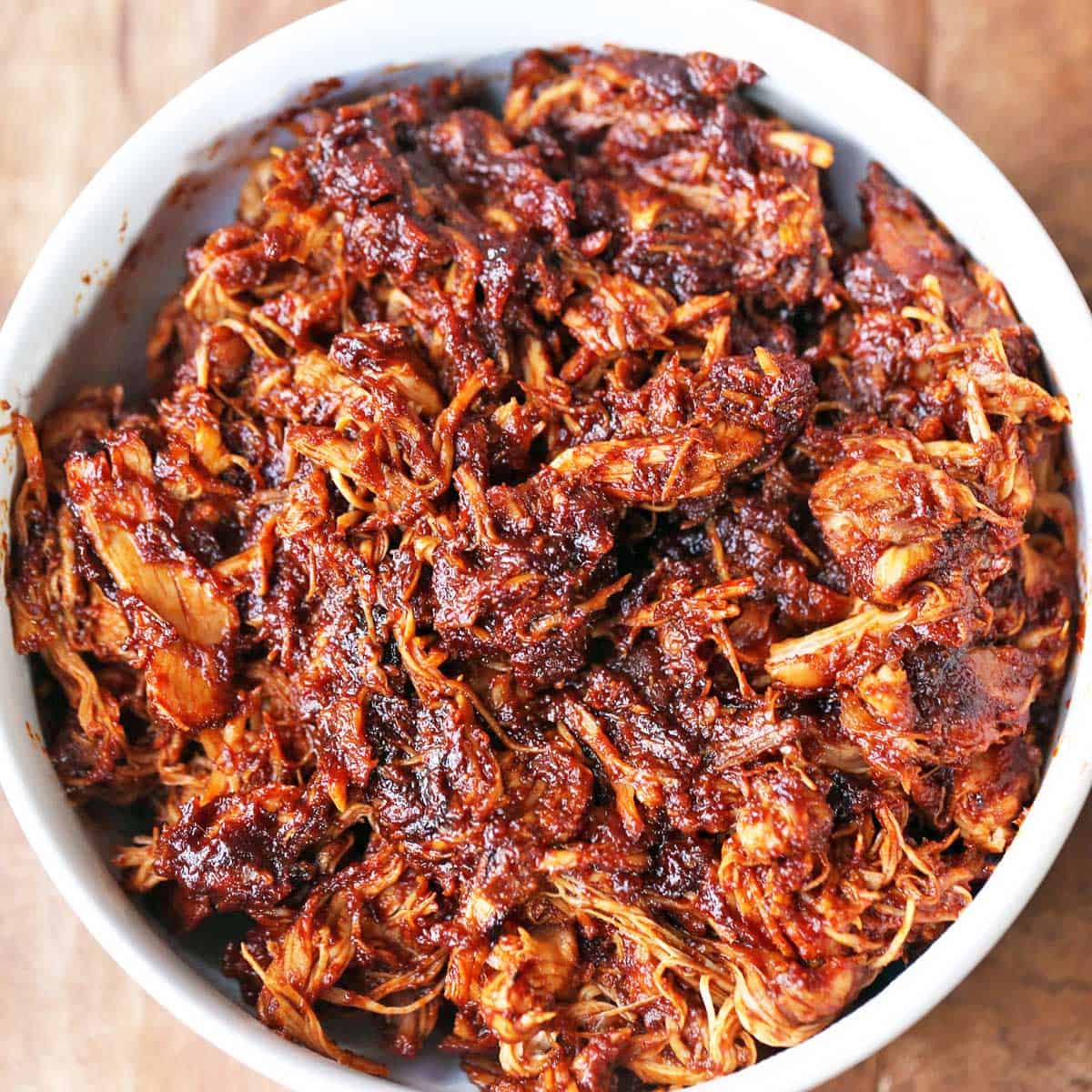 Pulled chicken is served in a bowl.