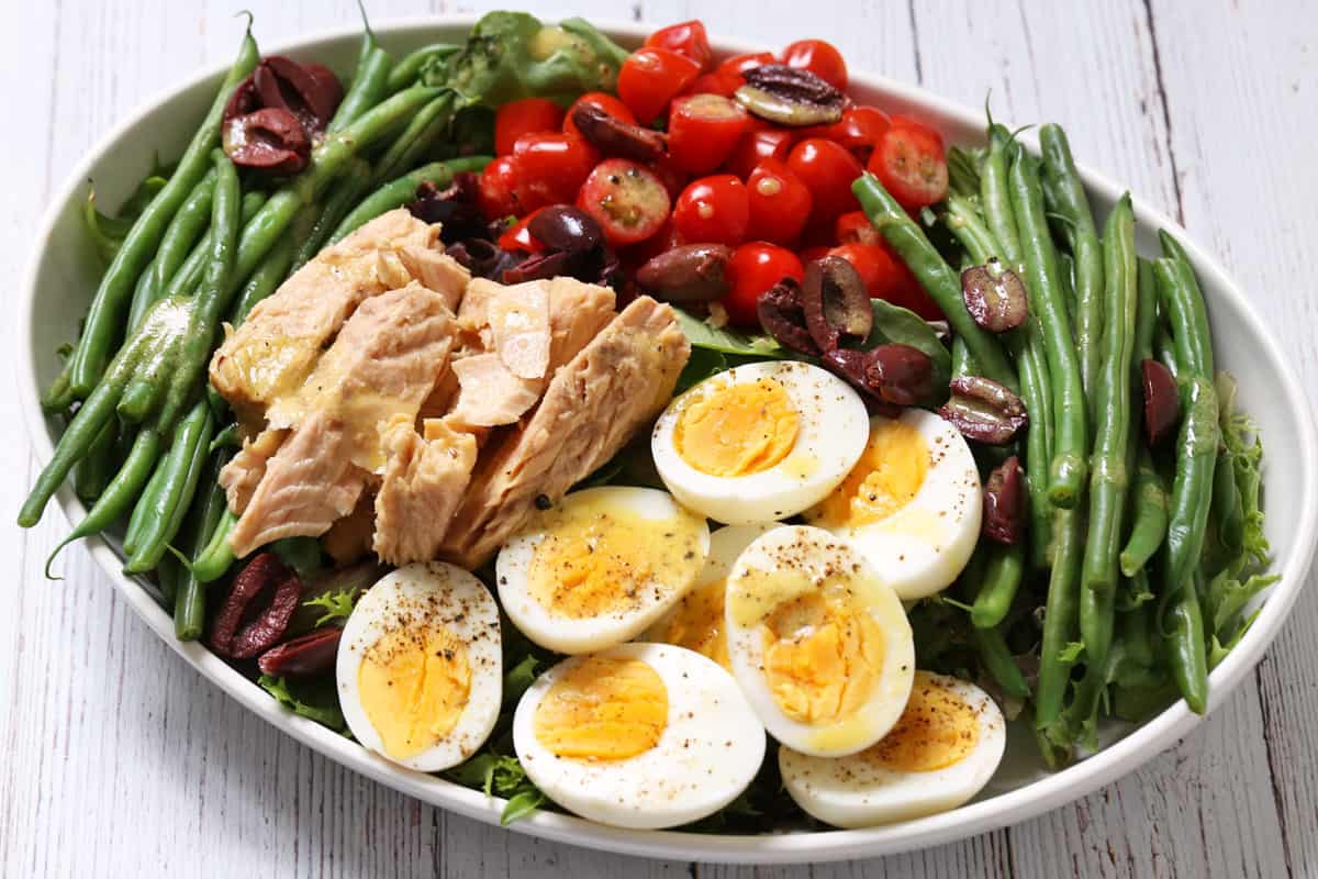 Haricot verts are served as part of a nicoise salad.