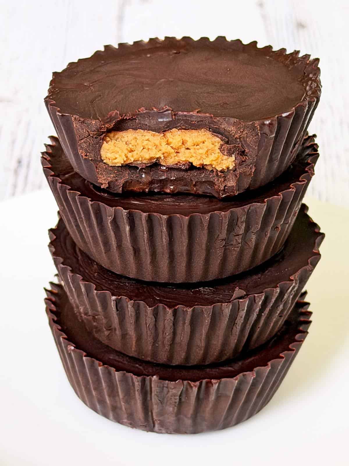 A stack of keto peanut butter cups on a plate.